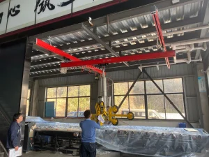 Ceiling mounted overhead bridge crane suspended from roof structure