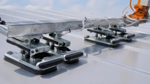 Roof and wall panel vacuum lifter with distributed suction pads