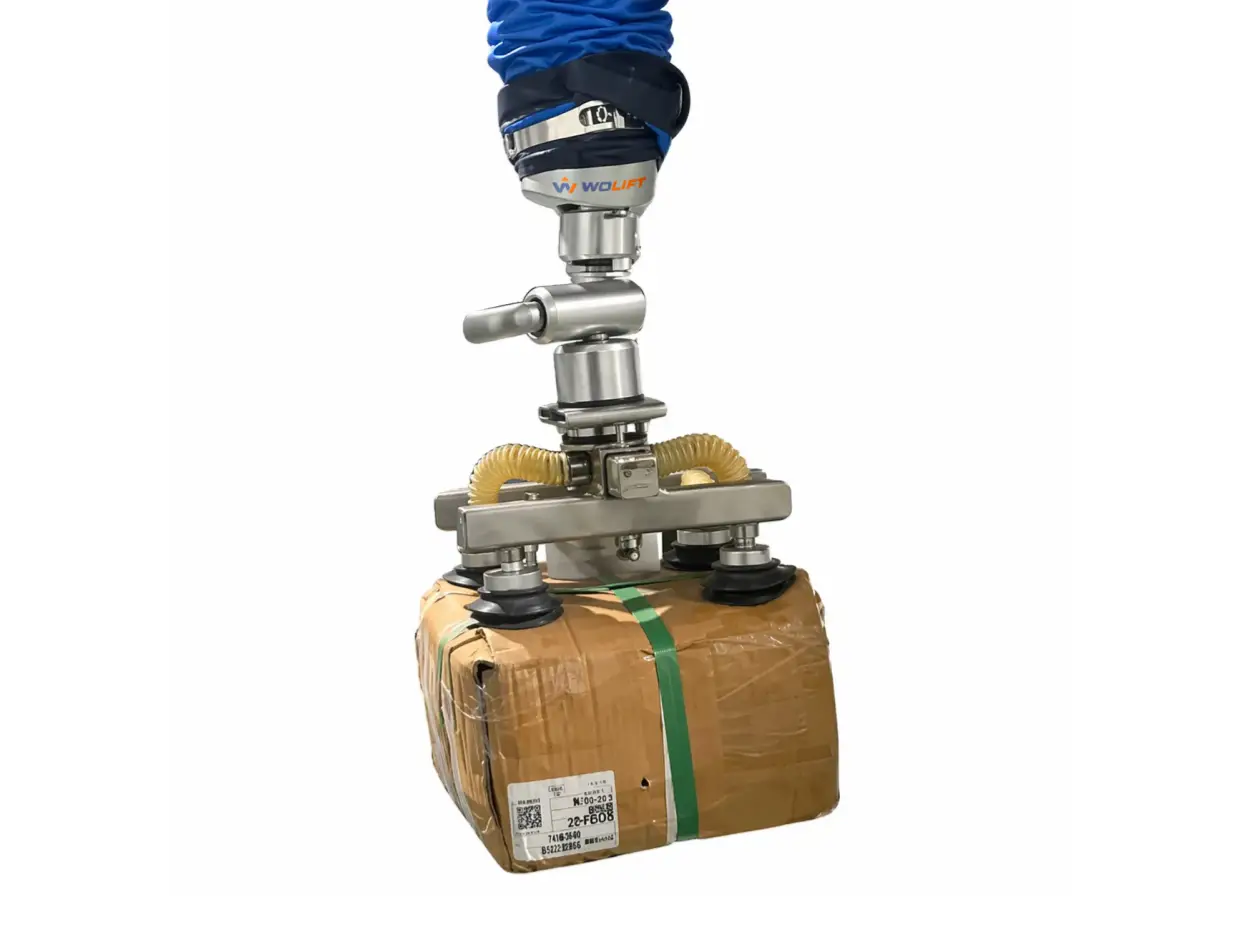 Vacuum tube lifter gripper on a strapped 100 kg air-conditioner carton for vertical lifting