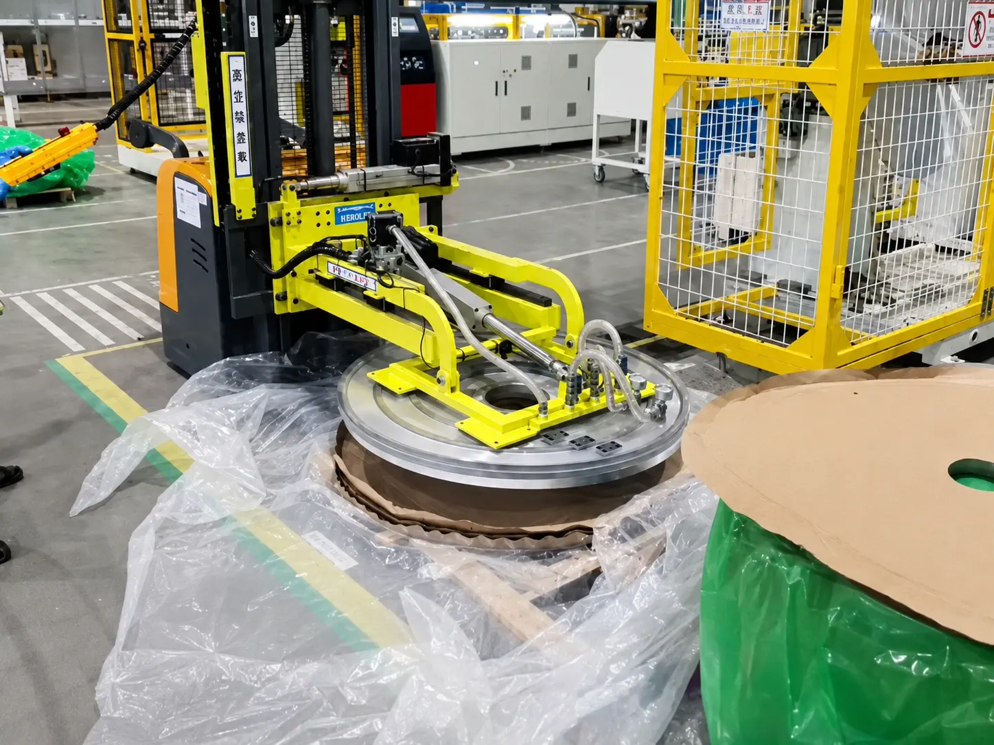 WOLIFT forklift-mounted coil vacuum lifter loading aluminum coil onto an uncoiler