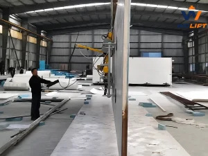 WOLIFT electric tilting vacuum lifter rotating an insulated panel from horizontal to vertical